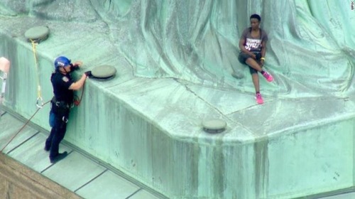 c4tbus:Today, Therese Patricia Okoumou, a Congolese immigrant, scaled the Statue of Liberty and said