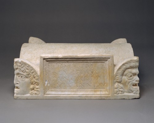 Marble lid of a cinerary chest, fashioned to look like the roof of a barrel-vaulted building with ac