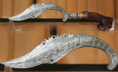 historical-nonfiction:  This is the kujang, a sickle-shaped dagger believed to uphold the balance of the world. Once popular with Javanese kings, the kujang’s distinctly shaped blade was believed to have been inspired by a divine message proclaiming