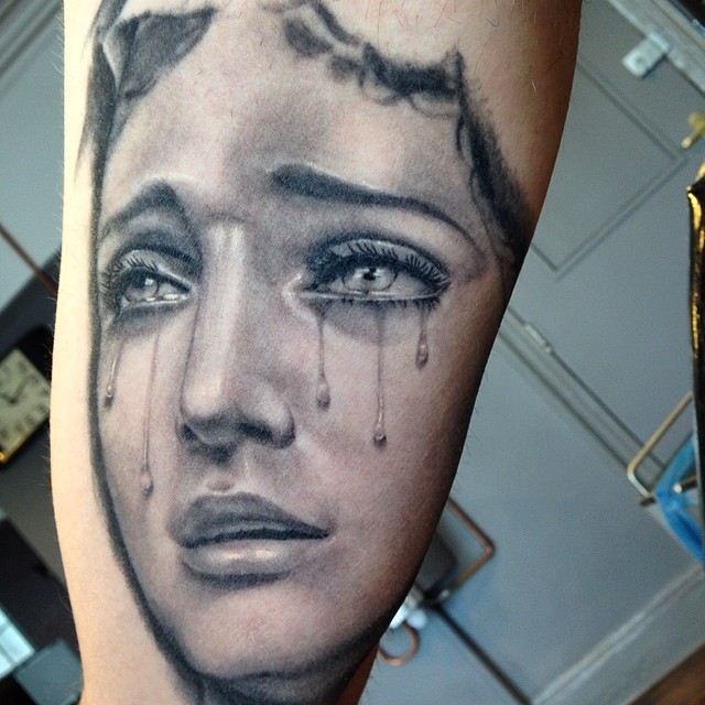 Crying Girls Face Tattoo Idea