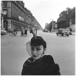 serafino-finasero:Fashion model with feathered hat and lace veil on the Rue de Rivoli, Paris, 1952 | photo Fred Brommet (Dutch, 1924–2008)