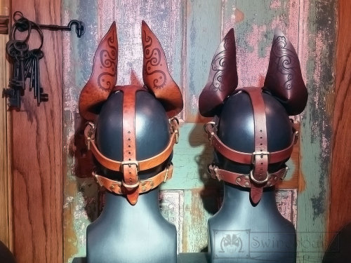 misterswinehound:  Two dog masks for the Anthrocon art show. The design engraved on these was created by my partner-in-artistic-crime over at http://bonepile.tumblr.com/.  We put the masks together.  I think they came out really great.