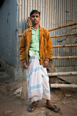 emoseman: Muhammed Abdullah, a young aged between 22-24 has resided at this camp built for garment workers of Gazipur, Bangladesh for over 18 years. He’s married with one son and they reside at his hometown of Jamalpur-Sherpur. Too often garment