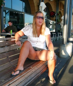 carelessinpublic:In a short skirt outside a restaurant and showing her pussy