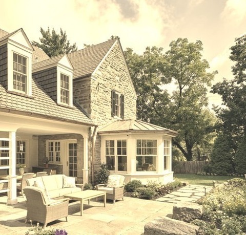 Stone Exterior In PhiladelphiaAn Illustration Of The Exterior Of A Medium-sized French Country Gray Two-story