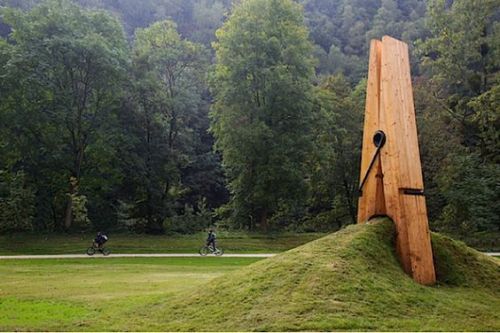 sixpenceee:  A giant clothespin sculpture appears to pinch a mound of grass & dirt in Liege, Belgium. Designed by Turkish artist & professor, Mehmet Ali Uysal. (Source) 