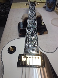 adamsramblings:  Here’s guitar pic #1 for the blogs birthday: it’s an LPC with a flame inlay fingerboard! 
