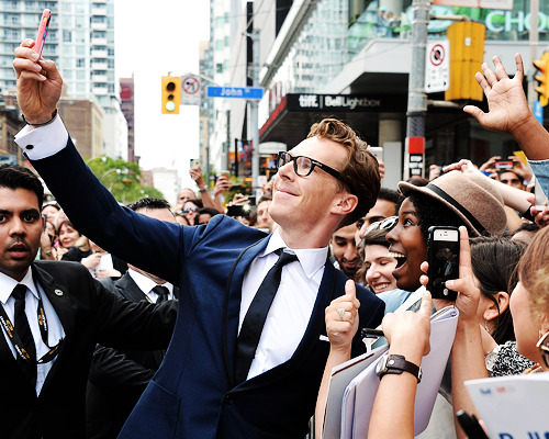 benedictdaily:Benedict Cumberbatch with fans at ‘The Imitation Game’ premiere during the 2014 Toront