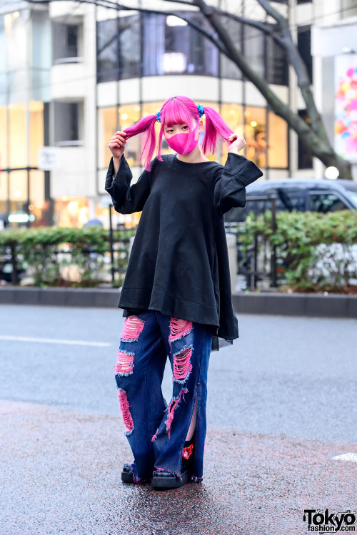 Japanese hair stylist Paso on the street in Harajuku with pink twintails, a pink face mask, an overs