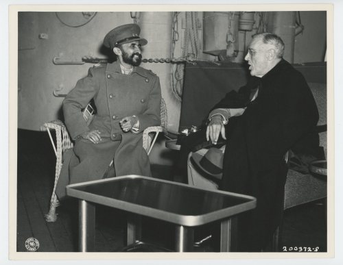 Franklin Roosevelt talks with Emperor Haile Selassie of Ethiopia and King Farouk of Egypt, on this d