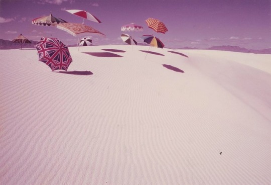 zzzze:  DEAN BROWN (1936 - 1973)Umbrellas in White Sands, New Mexico, ca. 1970Chromogenic print 