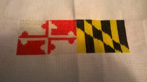 Half of my Maryland flag cross stitch is adult photos
