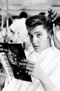vinceveretts:  Elvis getting a haircut at Jim’s Barber Shop in Memphis, July 1956. Photo by Lloyd Shearer. 