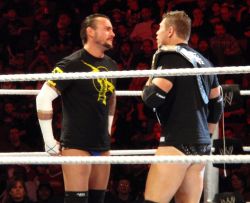 Hot stare down between Miz and Punk! Loser must give up their ass to the winner. Ring the bell already!