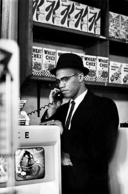 twixnmix:  Malcolm X photographed by Eve Arnold during his visit to enterprises owned by Black Musli