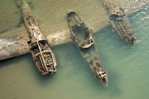 beautyofabandonedplaces:The remains of an American WWII aircraft that crashed on a beach in Wales [1