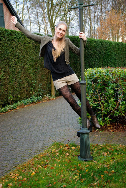 Patterned tights and green military style jacket