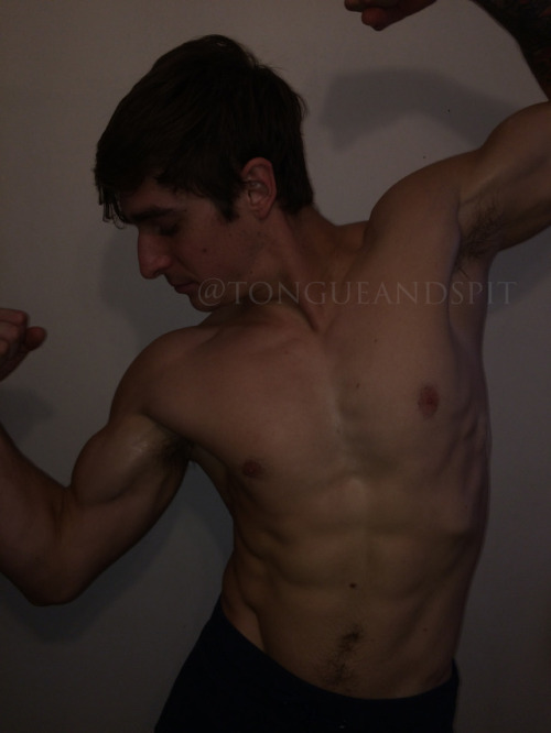 My friend Logan flexing his muscles.  adult photos