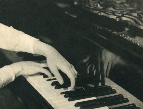 adanvc:Playing Piano. 1930s.by Laure Albin-Guillot