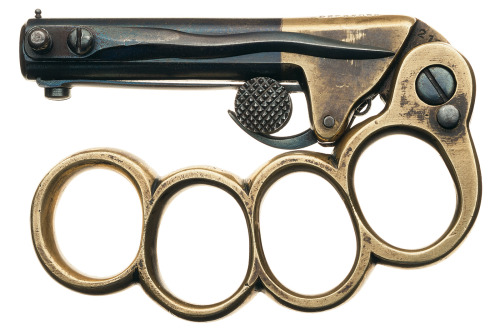 Two shot pistol/knuckduster combo with folding blade. Maker Unknown, late 19th century. Clearly this