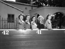 Police cadets Melva Myers, Betty Webster, Norma Johnston, Janet Elvedahl and Betty Hern posing with guns in Los Angeles, Calif., 1948