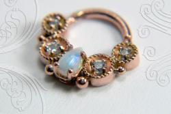 nan-a:  herr-lucifer:  leporids:  Rose gold, opal, and diamond clicker by Micah of Scylla Jewelry.  kill me    I must own it!