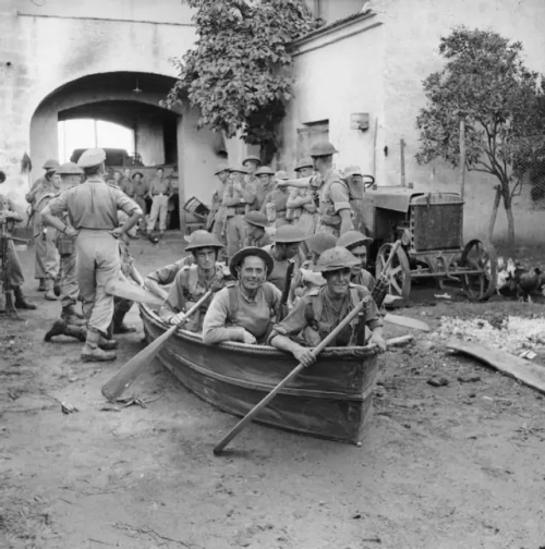 British Soldiers From 'B' Company, 1/6th Queen's Regiment Try Out Their Collapsible Boats In A Farmyard