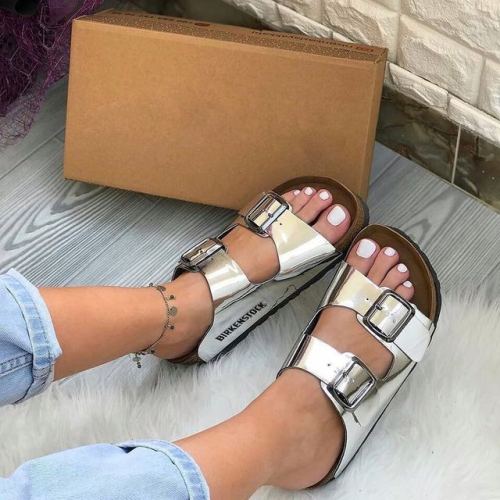 Silver Birks on pretty feet.