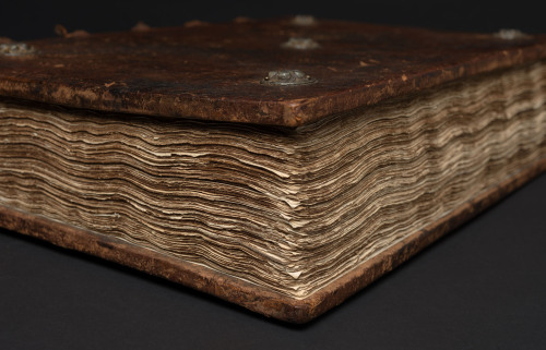A closeup view of the page edges of our copy of the Nuremberg Chronicle (1493). The fuzzy, irregular
