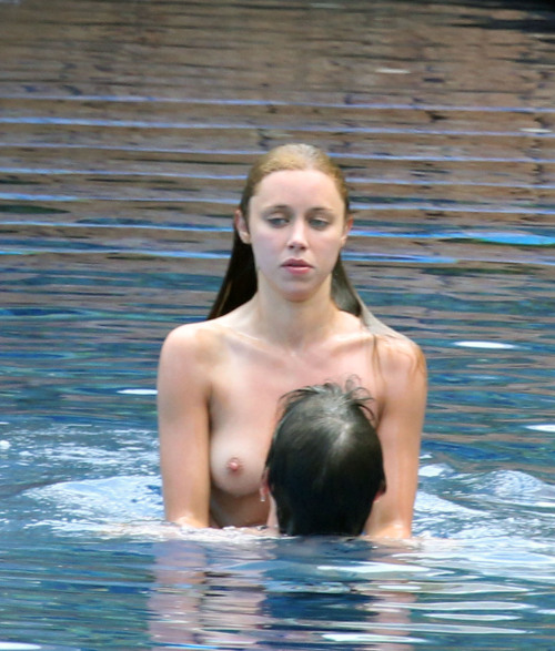 toplessbeachcelebs:  Una Healy (Singer) swimming topless at a resort in Spain (July 2010)