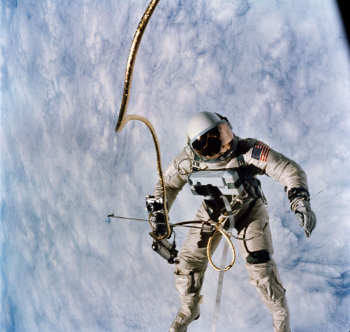 Astronaut Edward H. White, pilot for the Gemini IV spaceflight, floats in space during the first spa