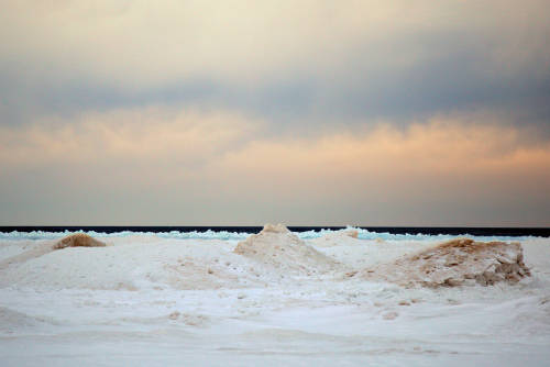 Lake Michigan.  The beaches are covered with ice and snow and hills of ice pushed up by the waves.