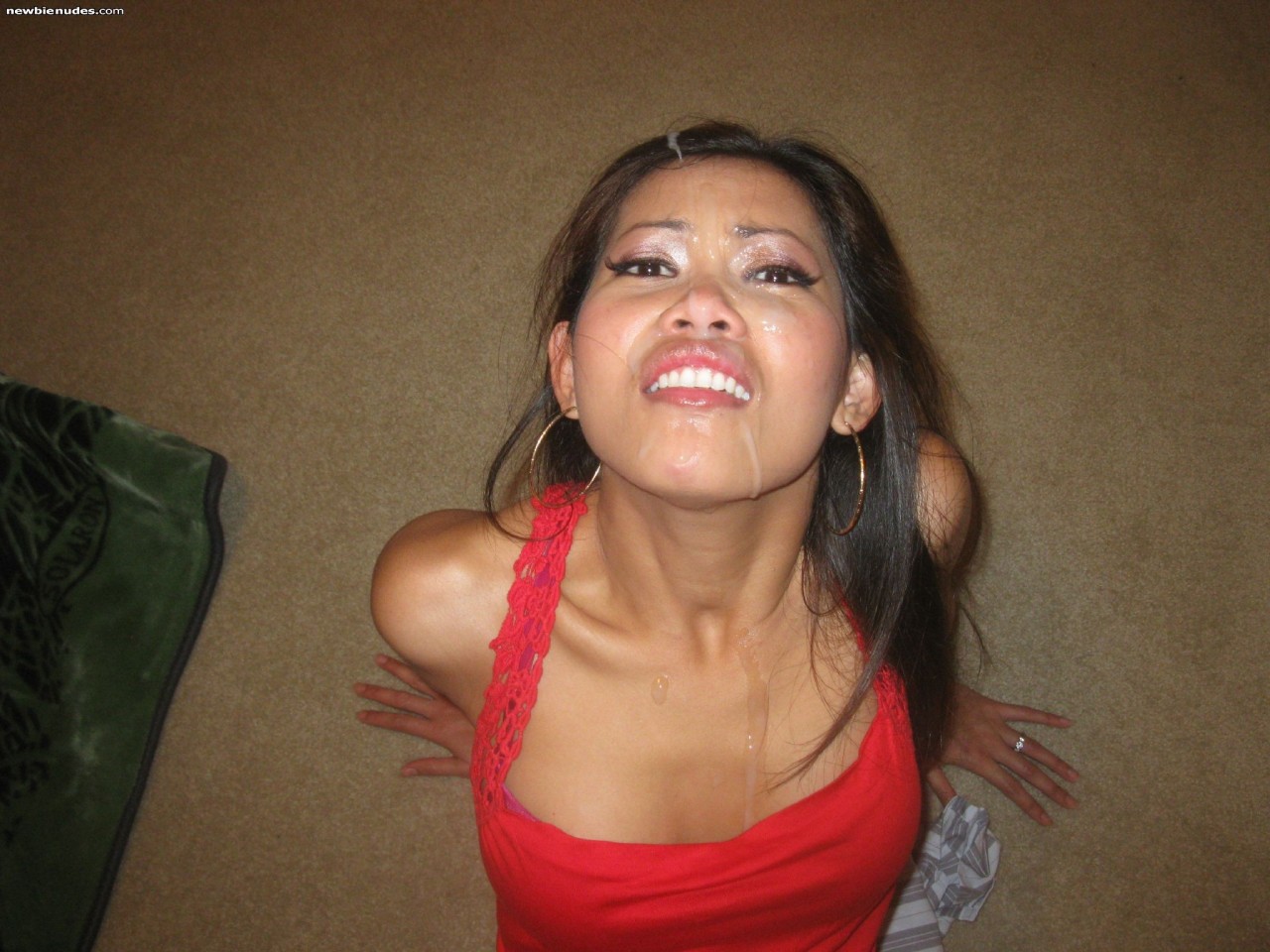 bukkake80:  Hot asian cum slut with a load on her face!