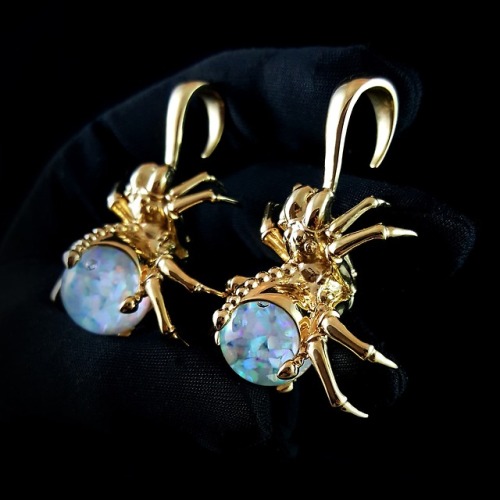 Arachne ear weights - polished brass with 16mm white floating opals. Now available.www.omniastudios.