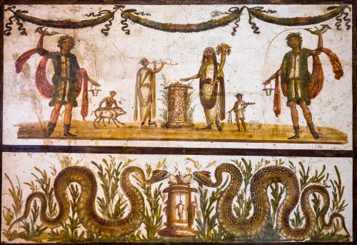 Wall painting from Pompeii.Above: two lares with rhyton and situla, genius offering at an altar, flu