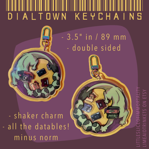 A collage that shows two photos of shaker charms against a purple background, and yellow text that reads DIALTOWN KEYCHAINS at the top. It pictures the front (Phonegingi) and back (Typegingi) of the keychain, featuring a design of the cryptid wrapping around its eggs. Inside are charms of Randy, Karen, Oliver, and Bigfoot. Bullet points read: 3.5" in / 89 mm, double sided, shaker charm, & all the datables! minus norm.