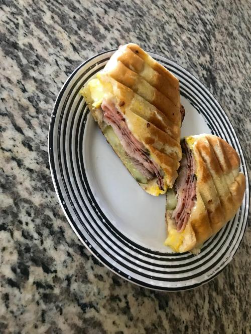 homemade Cubano with 18 hour marinated pork shoulder sliced ham dill pickles Swiss cheese and a spre