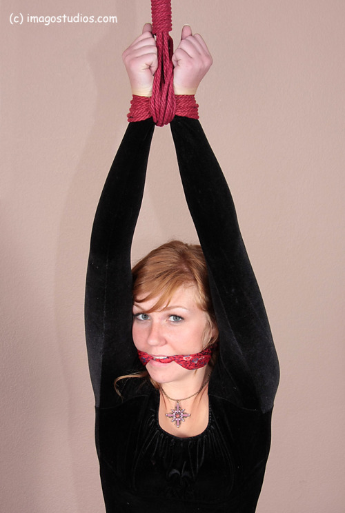 graybandanna:  Strung up with a scarf gag 