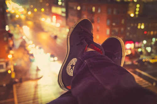 mikitakesphotos: Feet dangling off the rooftop. Harlem, NYC