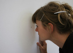 boyirl:  Jeppe Hein - Let me show you the World  (2000)Walking through the exhibition, the visitor might come to notice a small black spot on the wall amidst the other installed works. Closing in on the wall, the spot proves to be a small hole in it.