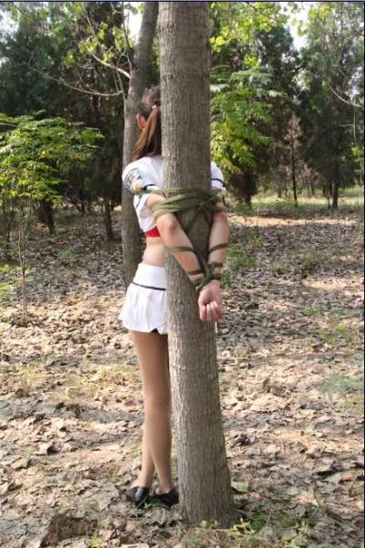 Totally inappropriate footwear. No wonder she ended up tied to a tree. 