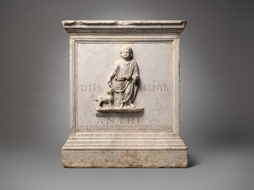 Marble funerary altar, carved in high relief with the figure of the deceased, named in the accompany