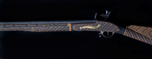 A replica Brown Bess flintlock musket decorated by Aboriginal artists Mario Munkara, Nathaniel Pilak