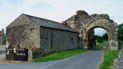 Byland Abbey Gatehouse, incorporated into Farm Buildings, North Yorkshire, England.