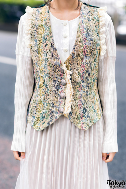 tokyo-fashion:  20-year-old Japanese student Mami on the street in Harajuku wearing a vintage pleated dress under a vintage floral brocade vest, and vintage silver bow-laced shoes. Full Look