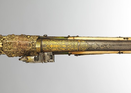 An Turkish miquelet musket decorated with gold, ivory, brass, mother of pearl, and jewels.  Late 18t