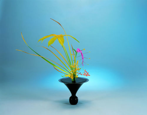 Japanese flower arrangement, known as ikebana or kadō (the way of the flower), developed into a dist