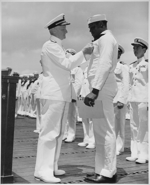 todaysdocument: Admiral C. W. Nimitz pins the Navy Cross on Cook 3rd Class Doris Miller, 5/27/1942.D