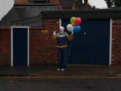 classyndbeautiful:  moviemeatloaf:  batteredpork: A creepy and anonymous clown has been terrifying residents of Northampton England by standing around on street corners and staring at passers-by. The clown, who bears a striking resemblance to Pennywise