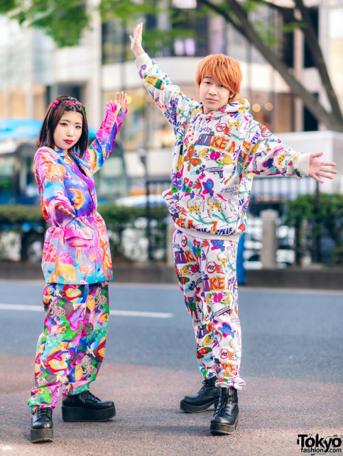 Chinatsu and Taishi - both 18 - on the street in Harajuku wearing colorful graphic fashion by the Ja